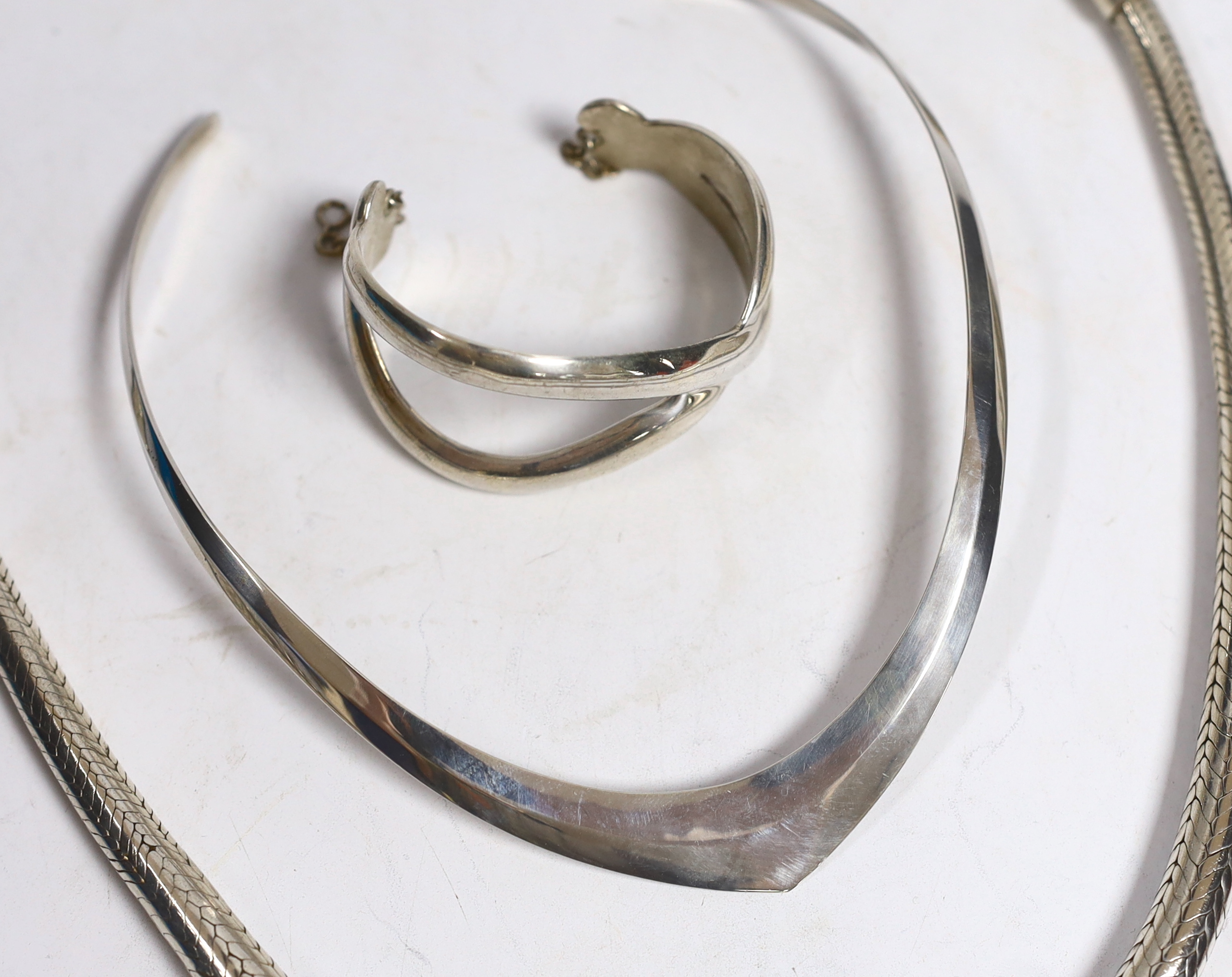 A large continental white metal snake link necklace, 44cm, a silver chain, a silver crossover bracelet and a 925 necklet.